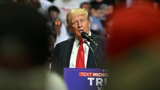 TOPSHOT - Former US President and 2024 presidential nominee Donald Trump speaks during a campaign rally with US Senator and vice presidential nominee J.D. Vance at Van Andel Arena in Grand Rapids, Michigan, on July 20, 2024. (Photo by Jim WATSON / AFP)(AFP)