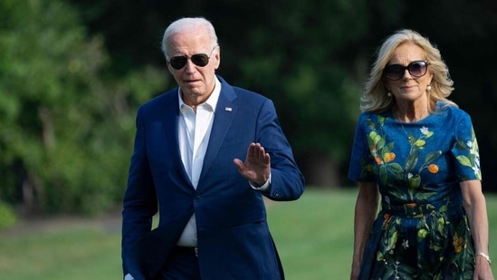 US President Joe Biden and First lady Jill Biden walk to the White House in Washington, DC, on Sunday, as they return after attending campaign events in Pennsylvania. (AFP)