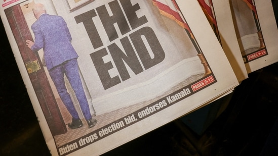 Assistant Shift Foreman Howard Fewell holds copies of the New York Post front page the day U.S. President Joe Biden announced that he is dropping his reelection bid, at the New York Times College (REUTERS)