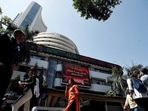 FILE PHOTO: FILE PHOTO: People walk past the Bombay Stock Exchange (BSE) building in Mumbai, India, March 9, 2020. REUTERS/Francis Mascarenhas/File Photo/File Photo