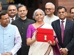 Union Finance Minister Nirmala Sitharaman showcases a red pouch carrying the Budget documents, outside the Finance Ministry in North Block (Hindustan Times) Union Finance Minister Nirmala Sitharaman showcases a red pouch carrying the Budget documents, outside the Finance Ministry in North Block (Hindustan Times)