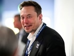FILE PHOTO: Tesla, X (formerly known as Twitter) and SpaceX's CEO Elon Musk speaks with other delegates on Day 1 of the AI Safety Summit at Bletchley Park in Bletchley, Britain on November 1, 2023. Leon Neal/Pool via REUTERS/File Photo