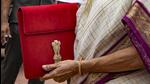 Union finance minister Nirmala Sitharaman with the Budget documents at the Parliament in New Delhi on Tuesday. (PTI Photo) Union finance minister Nirmala Sitharaman with the Budget documents at the Parliament in New Delhi on Tuesday. (PTI Photo)