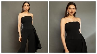 Draped in simplicity, Aditi exudes grace in this minimalistic black jumpsuit. With a strapless bodice and straight-across neckline, the dress stands out without the need for any embellishments or patterns. Cinched at the waist, the outfit gives a seamless hourglass shape. The jumpsuit is a sophisticated and chic choice for a formal event like an award show. (Instagram/@aditiraohydari) Draped in simplicity, Aditi exudes grace in this minimalistic black jumpsuit. With a strapless bodice and straight-across neckline, the dress stands out without the need for any embellishments or patterns. Cinched at the waist, the outfit gives a seamless hourglass shape. The jumpsuit is a sophisticated and chic choice for a formal event like an award show. (Instagram/@aditiraohydari)