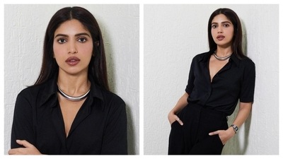 Bhumi Pednekar channeled boss-lady aura in this chic black jumpsuit from the brand Tod. Her outfit's plunging neckline highlighted the chunky, choker necklace. Her look was elevated by the striking silver statement neckpiece and a vintage Casio watch, adding a touch of retro charm. (Instagram/@bhumipednekar) Bhumi Pednekar channeled boss-lady aura in this chic black jumpsuit from the brand Tod. Her outfit's plunging neckline highlighted the chunky, choker necklace. Her look was elevated by the striking silver statement neckpiece and a vintage Casio watch, adding a touch of retro charm. (Instagram/@bhumipednekar)