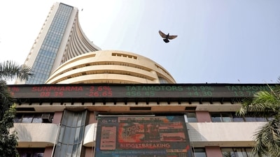A bird flies past a screen displaying the Sensex results on the facade of the Bombay Stock Exchange (BSE) building in Mumbai. (Niharika Kulkarni/Reuters)
