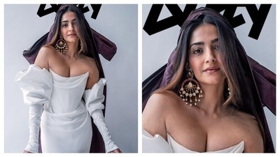 Sonam Kapoor dazzled in the photoshoot for Dirty Magazine, She wore an off-shoulder gown with a corset bodice and puffed sleeves. Her outfit had an old Hollywood vibe to it. With oversized earrings and a purple veil, she added colours to her monochrome outfit. (Instagram/@sonamkapoor) Sonam Kapoor dazzled in the photoshoot for Dirty Magazine, She wore an off-shoulder gown with a corset bodice and puffed sleeves. Her outfit had an old Hollywood vibe to it. With oversized earrings and a purple veil, she added colours to her monochrome outfit. (Instagram/@sonamkapoor)