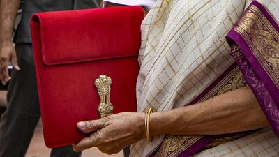 Union finance minister Nirmala Sitharaman with the Budget documents at the Parliament in New Delhi on Tuesday. (PTI Photo) Union finance minister Nirmala Sitharaman with the Budget documents at the Parliament in New Delhi on Tuesday. (PTI Photo)