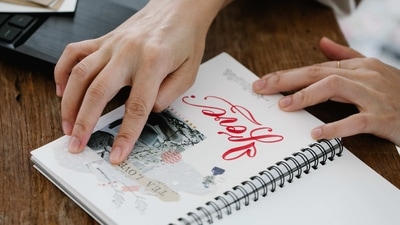4. Memory Scrapbook: A DIY scrapbook filled with photos, memories and heartfelt notes. (Pexels)