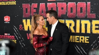 Ryan Reynolds with wife Blake Lively at the premiere. Blake hit the red carpet in a femme fatal version of Deadpool's red ensemble. She also bought her BFF Gigi Hadid to the premiere, who was channeling Hugh Jackman's counterpart in her red carpet outfit. 