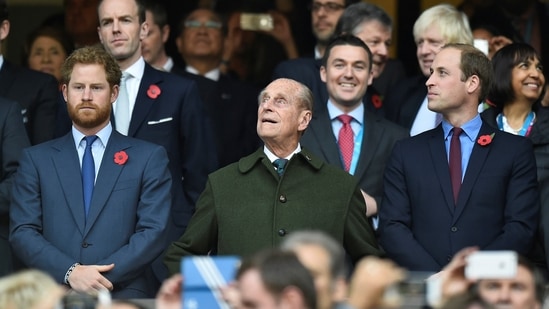 Britain's Prince Harry, Prince Philip and Prince William (L-R) attend the Rugby World Cup final match between New Zealand against Australia at Twickenham in London, Britain October 31, 2015. (REUTERS)