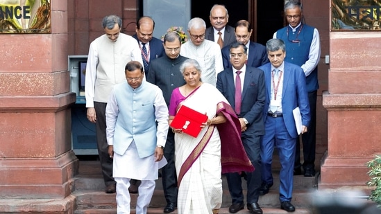 Budget 2024 cheaper and costlier list: Finance Minister Nirmala Sitharaman holds a folder with the Government of India's logo while leaving her office to present the union budget in the parliament in New Delhi, India, July 23, 2024. REUTERS/Altaf Hussain(REUTERS)