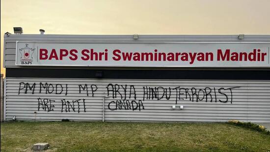 The graffiti spraypainted on the front portion of the BAPS Shri Swaminarayan Mandir in Edmonton, on Monday.