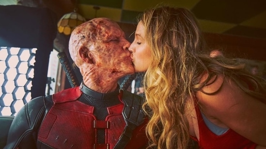 Blake Lively kisses Ryan Reynolds in his Deadpool prosthetic