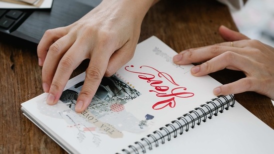 4. Memory Scrapbook: A DIY scrapbook filled with photos, memories and heartfelt notes.(Pexels)