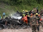 Fire services and Nepal Police personnel at the Tribhuvan International Airport where a plane crashed claiming the lives of 18 people, in Kathmandu on Wednesday. According to Nepal police, 19 people were onboard. (ANI) Fire services and Nepal Police personnel at the Tribhuvan International Airport where a plane crashed claiming the lives of 18 people, in Kathmandu on Wednesday. According to Nepal police, 19 people were onboard. (ANI)