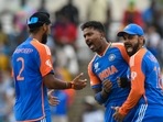 India's Hardik Pandya (C) and teammate Virat Kohli (R) and Arshdeep Singh (L) during T20 World Cup 2024(AFP) India's Hardik Pandya (C) and teammate Virat Kohli (R) and Arshdeep Singh (L) during T20 World Cup 2024(AFP)