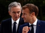 LVMH luxury group CEO Bernard Arnault, left, and French President Emmanuel Macron. (AP) LVMH luxury group CEO Bernard Arnault, left, and French President Emmanuel Macron. (AP)