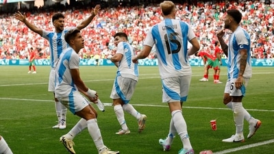 Morocco fans throw cups to Argentina players after Cristian Medina of Argentina scores their second goal which was disallowed later. (Reuters) Morocco fans throw cups to Argentina players after Cristian Medina of Argentina scores their second goal which was disallowed later. (Reuters)