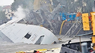 Indian Navy frigate INS Brahmaputra tilted to one side after fire damages. (ANI) Indian Navy frigate INS Brahmaputra tilted to one side after fire damages. (ANI)