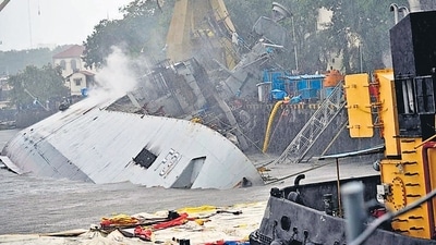 Indian Navy frigate INS Brahmaputra tilted to one side after fire damages. (ANI) Indian Navy frigate INS Brahmaputra tilted to one side after fire damages. (ANI)