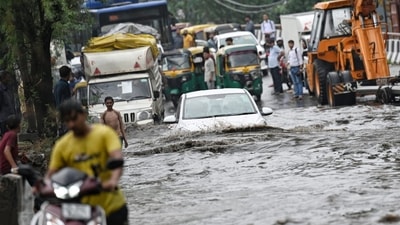 A view of heavily waterlogged street near Punjabi Bagh in New Delhi after heavy rain on Wednesday morning. (Sanchit Khanna/HT)