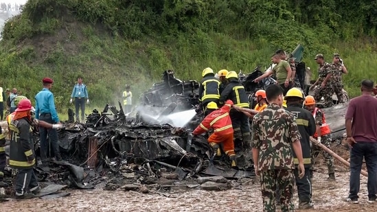 Fire services and Nepal Police personnel at the Tribhuvan International Airport where a plane crashed claiming the lives of 18 people, in Kathmandu on Wednesday. According to Nepal police, 19 people were onboard. (ANI)