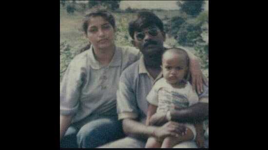 An old picture of Flt Lt S Muhilan, with his wife Bina and son Dhruv (Sourced)