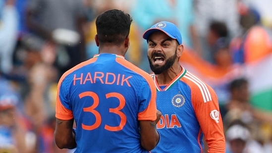 India's Hardik Pandya celebrates with Virat Kohli after South Africa's David Miller was caught out by Suryakumar Yadav