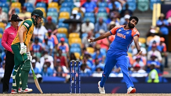 Jasprit Bumrah (R) bowls during the ICC men's Twenty20 World Cup 2024 final cricket match between India and South Africa