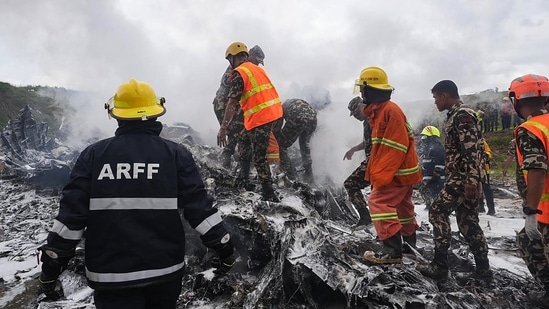Nepal plane crash LIVE: Rescuers and army personnel stand at the site after a Saurya Airlines' plane crashed during takeoff at Tribhuvan International Airport in Kathmandu on July 24, 2024.