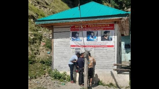 Posters of wanted terrorists displayed at police stations across Doda district. The police have announced rewards of <span class='webrupee'>?</span>30 lakh for information on local militants active in Doda district, particularly one of the oldest surviving militants, Mohammad Amin, alias Jahangir Saroori, a top commander of the Hizbul Mujahideen, who has evaded security forces for more than three decades. (HT Photo)