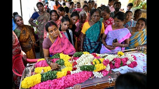 Relatives mourn near the deceased who consumed toxic alcohol in Kallakurichi district of India's Tamil Nadu state on June 24, 2024. The death toll from a batch of toxic illegal alcohol in India had risen to 56, police said on June 24, with 117 people in hospital recovering from the deadly drink. (AFP)