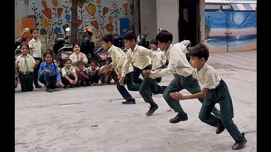 Students of Government Senior Secondary School, Cemetery Road taking part in sports activities during the Education Week celebrations in Ludhiana. (HT Photo)