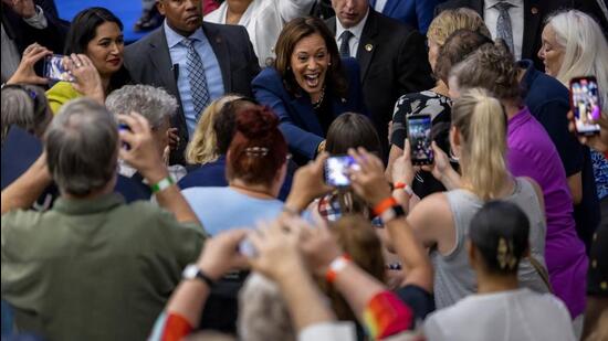 US Vice-President Kamala Harris greets supporters during her first campaign event as a candidate for president at West Allis High School in West Allis, Wisconsin, on Tuesday. (REUTERS)