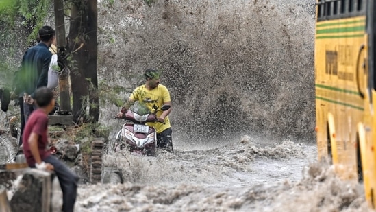 A view of a heavily waterlogged street near Punjabi Bagh after sudden rain on Wednesday morning in New Delhi, (Sanchit Khanna/HT)