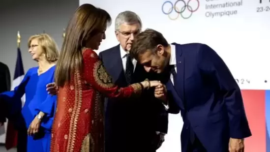 https://www.mobilemasala.com/fashion/Nita-Ambani-in-embroidered-red-suit-gets-warm-welcome-at-2024-Paris-Olympics-event-by-Emmanuel-Macron-i283606