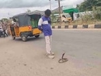 A drunk man was filmed 'playing' with a venomous cobra. A drunk man was filmed 'playing' with a venomous cobra.