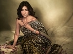Chitrangda Singh radiates understated elegance in a black Banarasi silk saree adorned with peacock motifs by Vidhi Singhania. She complements the look with a statement nath featuring diamond and polki jadau from Tvisha Jewlz by Himanshu Khunteta