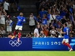France's Alexandre Lacazette, left, celebrates after scoring his side's first goal during the men's Group A soccer match between France and the United States (AP) France's Alexandre Lacazette, left, celebrates after scoring his side's first goal during the men's Group A soccer match between France and the United States (AP)