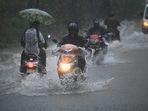 People driving through water-logged roads at Aarey colony in Mumbai. (HT Photo) People driving through water-logged roads at Aarey colony in Mumbai. (HT Photo)