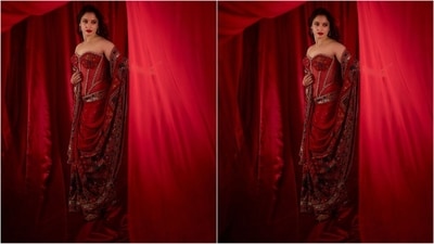 Her stunning red saree features luxurious crepe silk fabric adored with digital print and intricate hand sequin embroidery. She paired it up with an off-shoulder corset blouse that has butterfly net and embellished detailing, The contemporary drape further elevated her look. (Instagram/@tamannaahspeaks) Her stunning red saree features luxurious crepe silk fabric adored with digital print and intricate hand sequin embroidery. She paired it up with an off-shoulder corset blouse that has butterfly net and embellished detailing, The contemporary drape further elevated her look. (Instagram/@tamannaahspeaks)