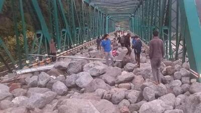 Debris on a bridge on the Anjani Mahadev rivulet near Manali after the cloudburst triggered a flashflood in the area on Wednesday night, leading to the closure of the highway to Leh. (HT Photo)