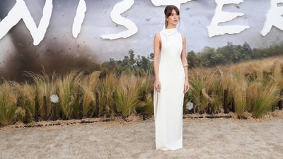 For the LA premiere of Twisters on July 11, the actress stunned in a white floor-length, open-back Gucci dress with an asymmetrical cowl neckline and a sash hanging at the back from one side. (REUTERS)