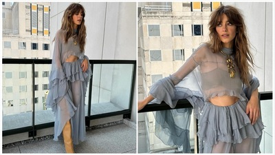 On July 18, she wore a total of four ensembles, including a flowy, midriff bearing, baby blue, two-piece set from Chloe, paired with a statement gold necklace and thigh-high tan boots. The sheer, frilly, jellyfish-like fit was giving Bohemian dreams! On July 18, she wore a total of four ensembles, including a flowy, midriff bearing, baby blue, two-piece set from Chloe, paired with a statement gold necklace and thigh-high tan boots. The sheer, frilly, jellyfish-like fit was giving Bohemian dreams!