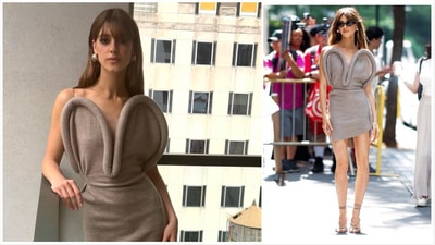 Her second look of the day was a grey minidress with an exaggerated sweetheart neckline of structured boning, paired with strappy heels of the same colour, Jenny Bird chunky gold earrings, and shades from Velvet Canyon. Her second look of the day was a grey minidress with an exaggerated sweetheart neckline of structured boning, paired with strappy heels of the same colour, Jenny Bird chunky gold earrings, and shades from Velvet Canyon.