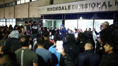 Protesters are seen outside Rochdale Divisional Headquarters in Rochdale, Manchester, UK on July 24, 2024. (Shutterstock)