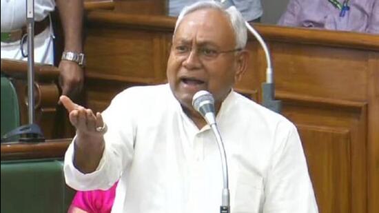 Bihar chief minister Nitish Kumar gestures towards the Opposition in the assembly in Patna. (Santosh Kumar/ HT Photo)