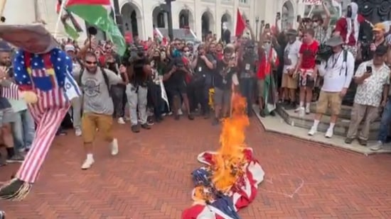 Crowd burns American flags in Washington to protest Netanyahu's visit (@TimcastNews screenshot/X)