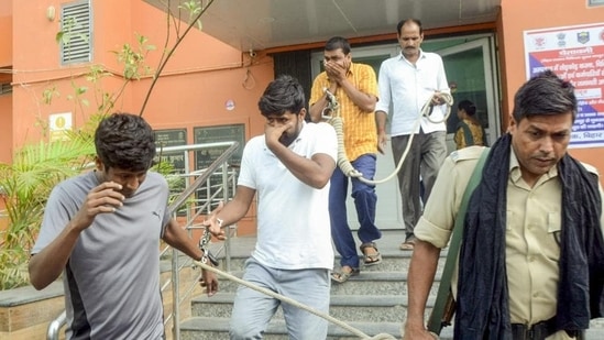 Economic Offences Unit officials leave with the accused arrested in the NEET paper leak case, in Patna, on Sunday. (PTI)